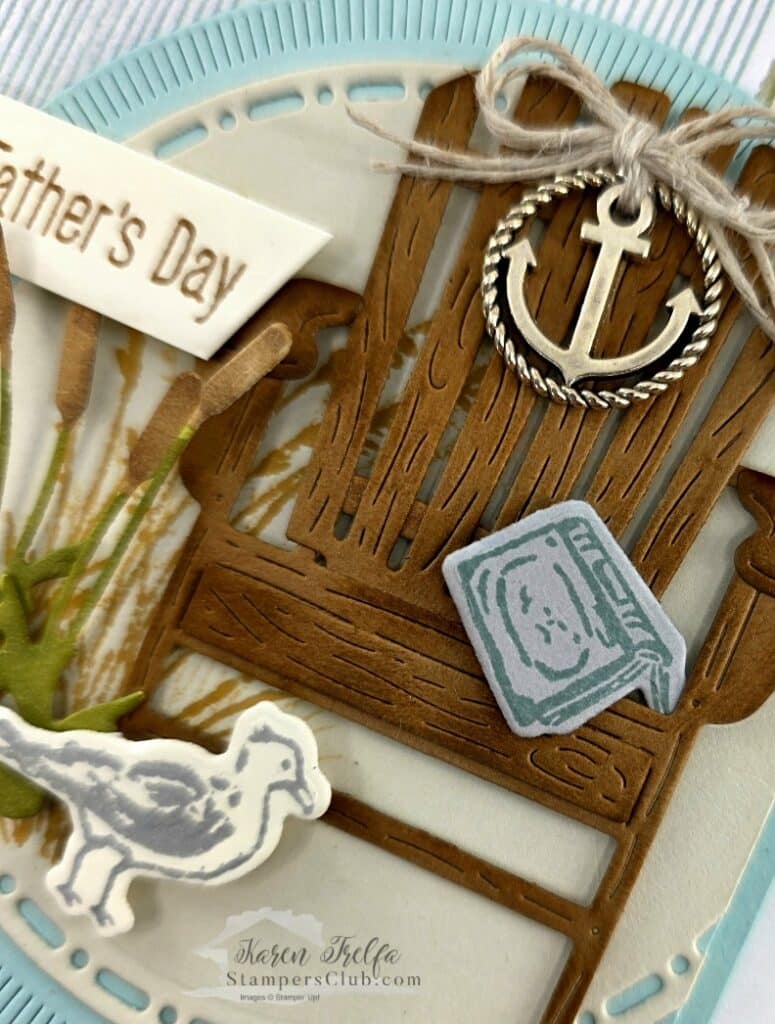 Close up detail of Waterside Retreat WOW card showing anchor trinket tied with linen thread and book embellishment by Karen Trelfa Stampers Club