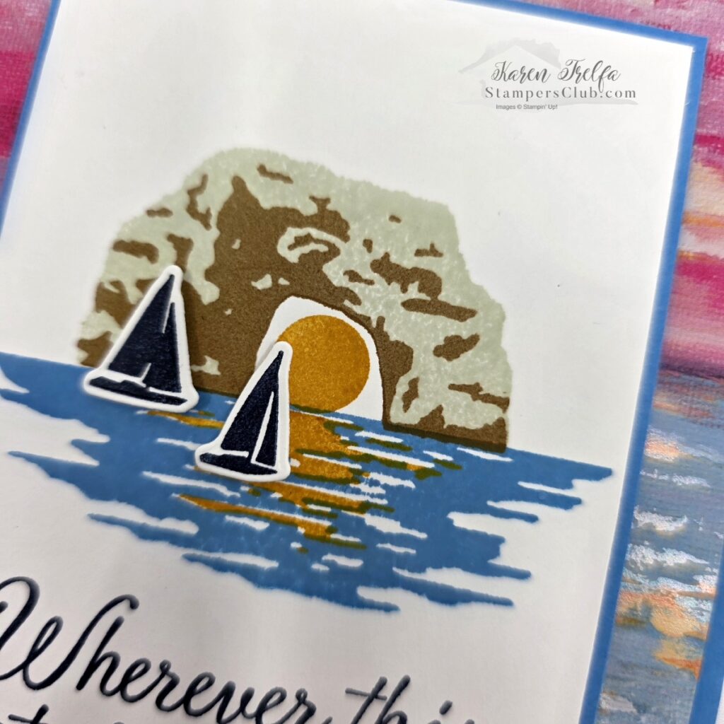 scenic-coast-rock-arch-sailboat-detail Close-up of stamped rock arch with golden embossed sun and two layered sailboat die cuts from a Scenic Coast Stampin' Up card showing water reflection detail on white cardstock